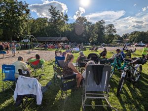 Image of people enjoying the live music at the 2nd Beach Bash of the summer at Mosquito Lake State Park. August 2024.