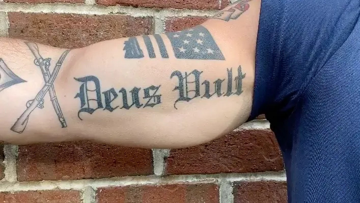 Pete Hegseth's tattoo of the Latin phrase “Deus Vult” that means “God Wills It.”