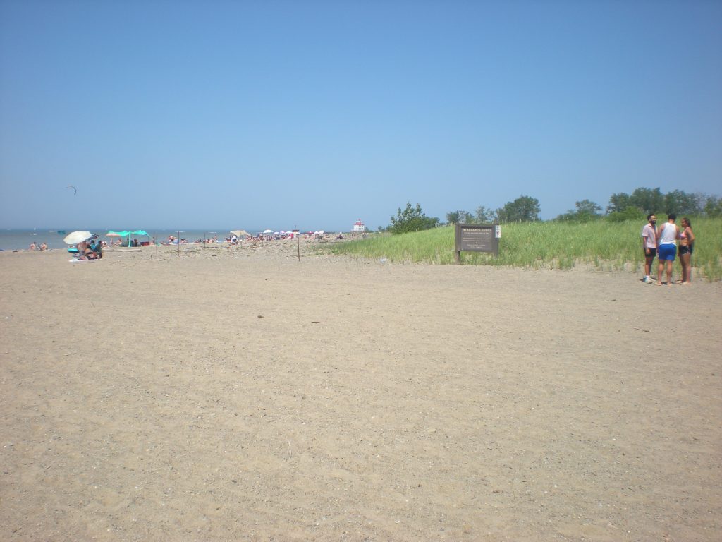 Headlands Beach; Mentor, Ohio; summer solstice weekend 2025, looking east towards lighthouse.