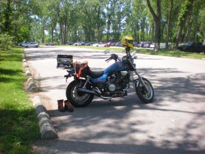 Maggie, naked (without saddlebags) at Headlands Beach in Mentor, Ohio on solstice weekend 2025. She is my 1984 Honda Magna v65 motorcycle.