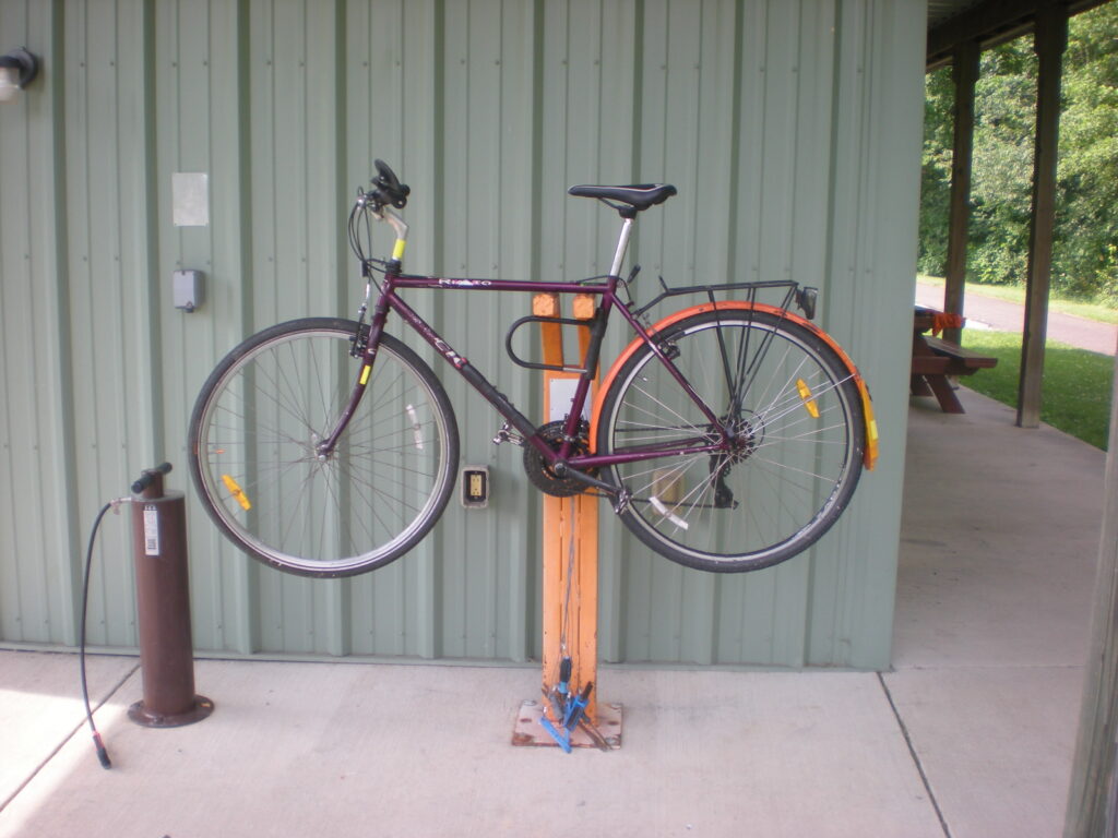 Cignal Rialto bicycle on stand at Sunside Trailhead | July 2025. My Cignal Rialto commuter bicycle on bike stand at Sunside Trailhead of Western Reserve Greenway Rail-Trail in Trumbull County Ohio MetroParks | July 2025.